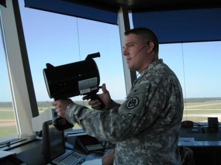 Military air traffic controller with light gun. Courtesy Wikipedia. Langley Flying School.