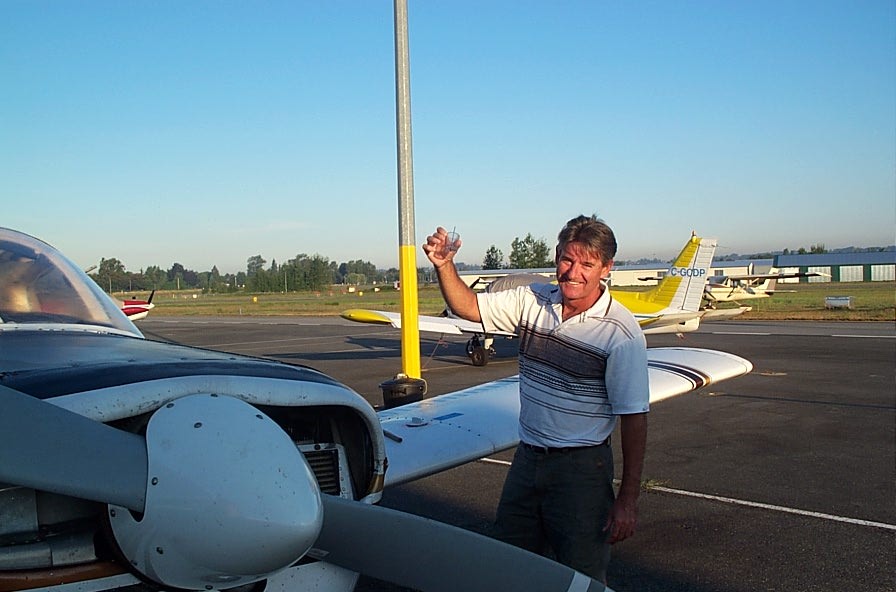 Preflight inspection of fuel.  Langley Flying School.
